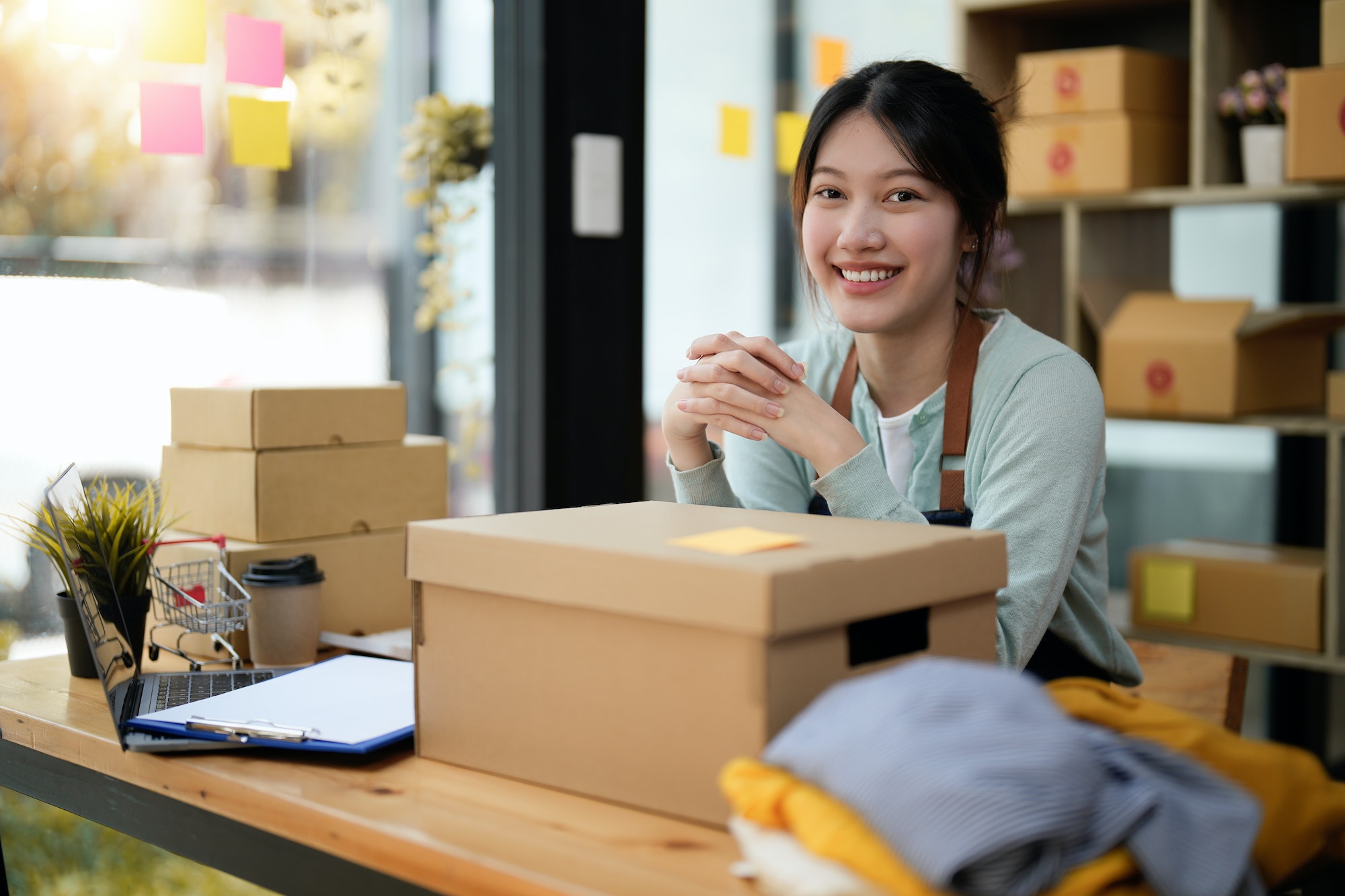 Startup small business entrepreneur SME, asian woman packing box. Portrait of young Asian small